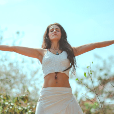 lady with arms open wide